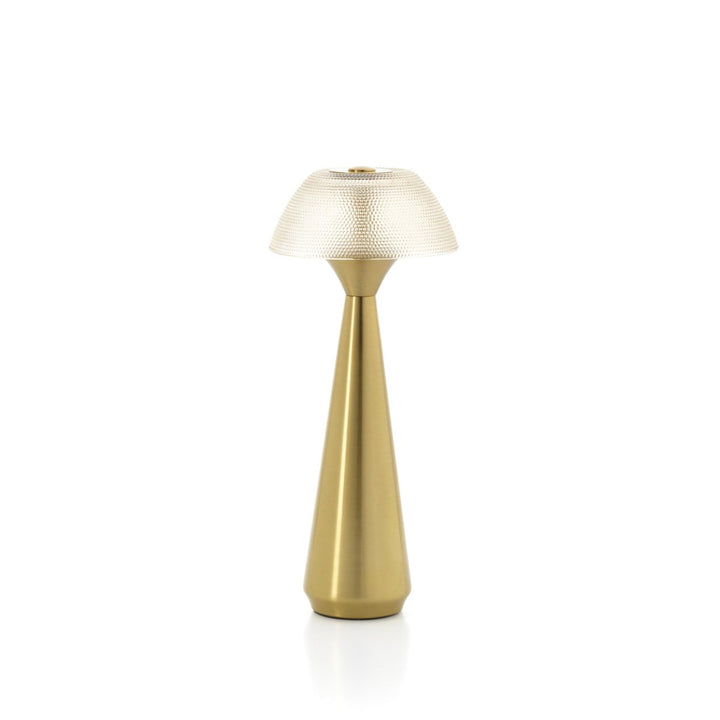 Gold table lamp with textured shade on a white background