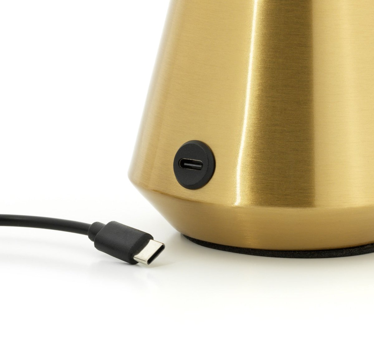 Gold lamp base with USB cable on a white background