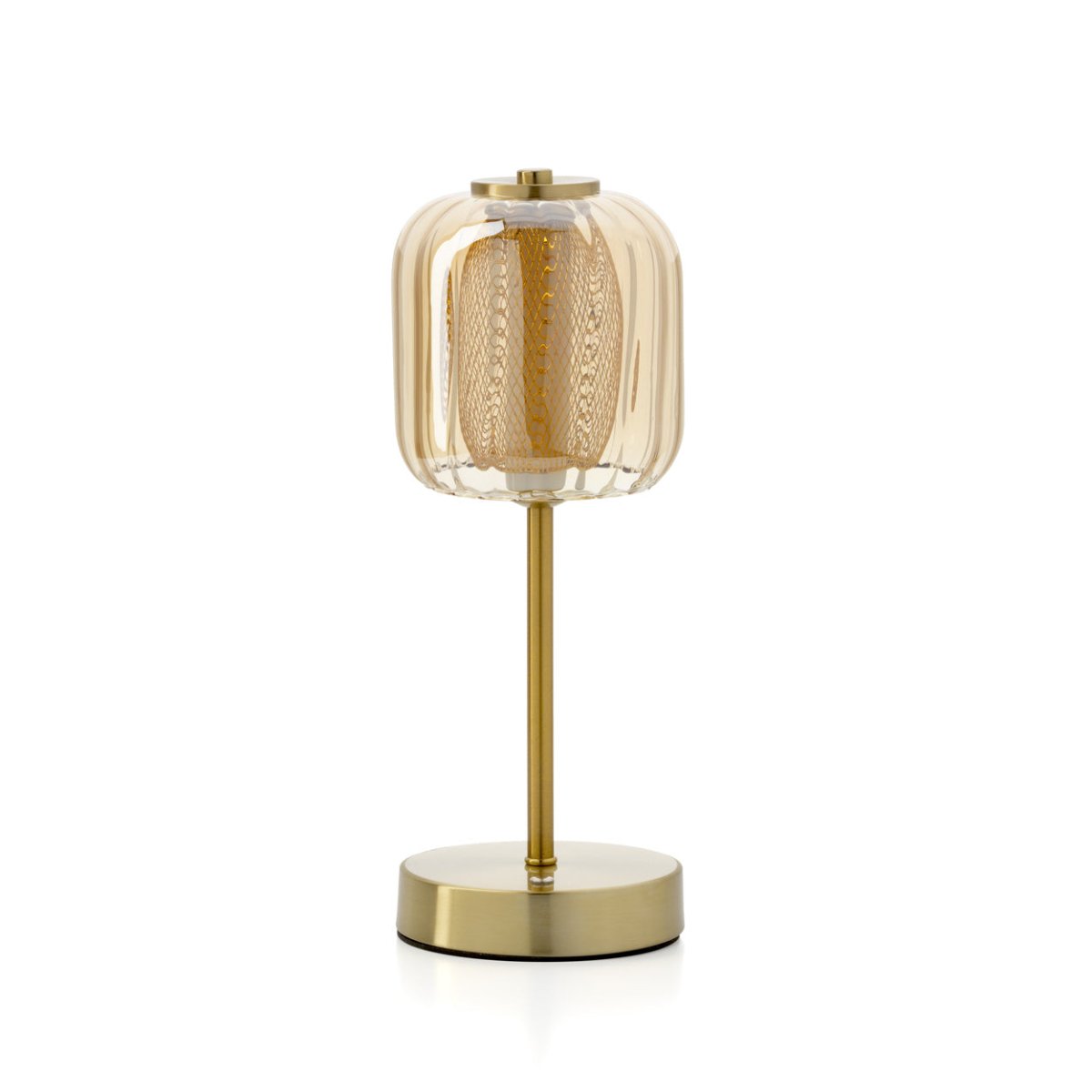 Table lamp with gold base and transparent glass shade on a white background