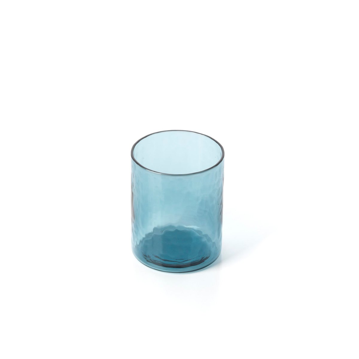 Blue glass tumbler on a white background