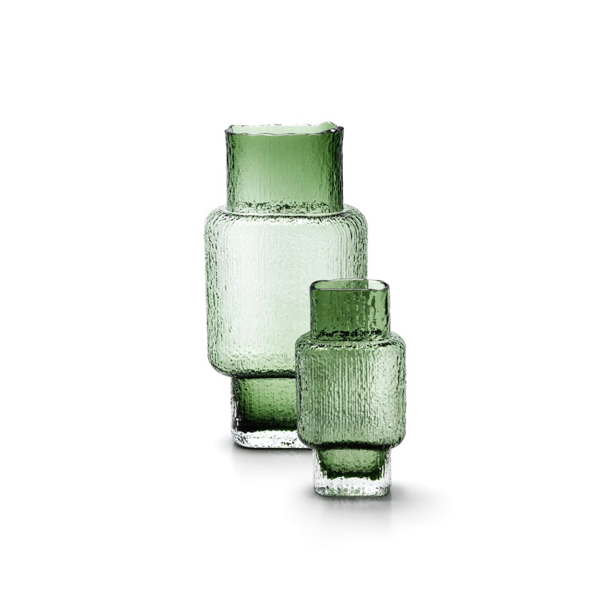 Set of three green glass vases on a white background