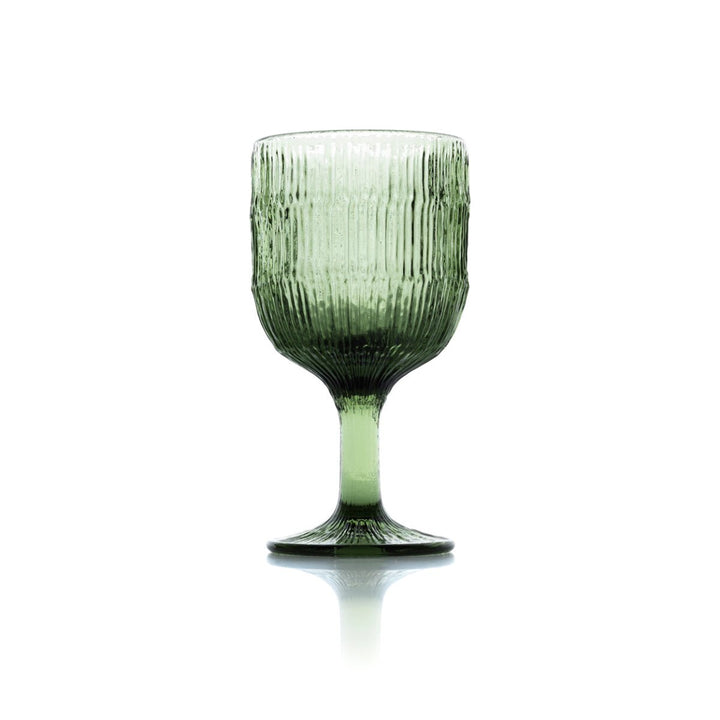 Green glass with textured surface on a white background