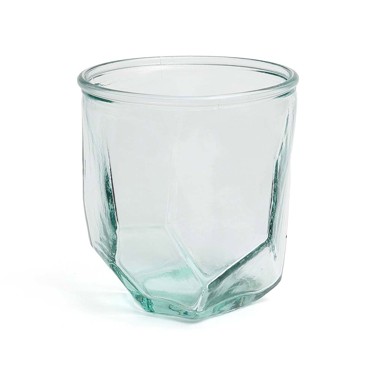 Clear glass tumbler with geometric design on a white background