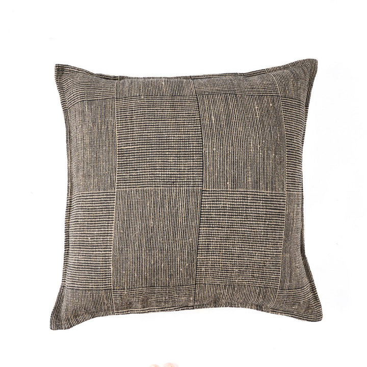 Textured square pillow with a checkered pattern on a white background