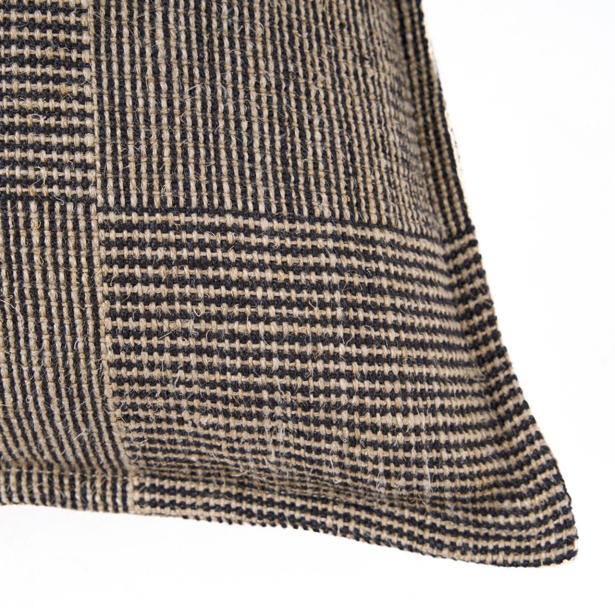 Close-up of a textured fabric with a checkered pattern on a white background