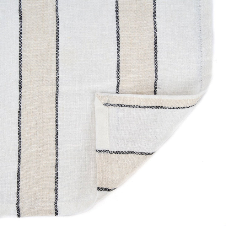 Close-up of a textured fabric with black vertical stripes on a white background