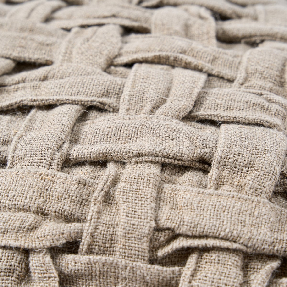 Close-up of woven beige fabric texture