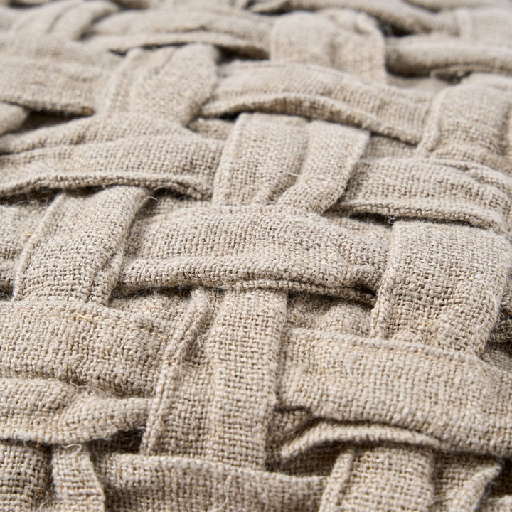 Close-up of woven beige fabric texture