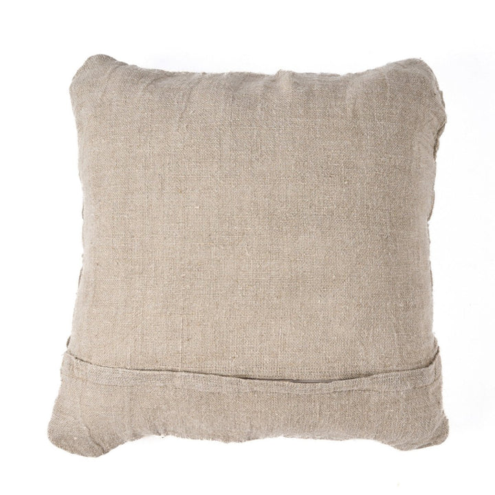 Beige textured pillow on a white background