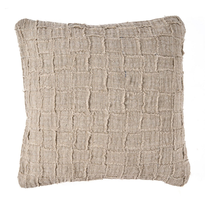 Textured beige pillow on a white background