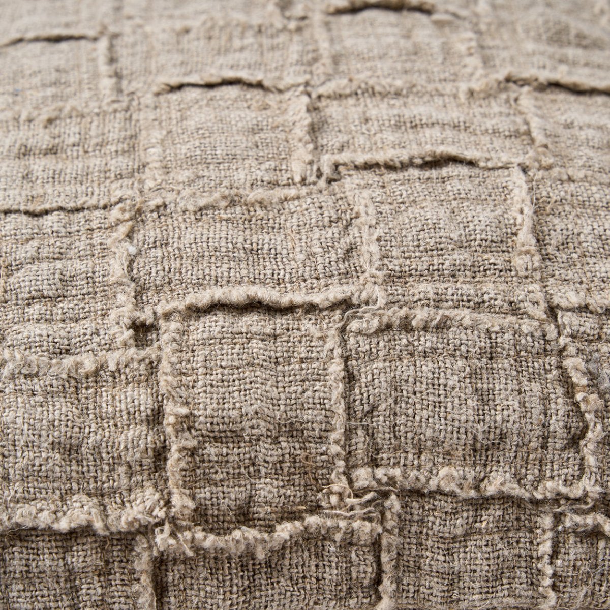 Close-up of textured fabric with a checkered pattern