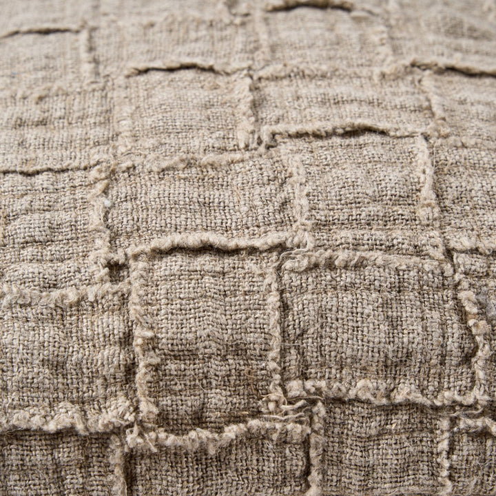 Close-up of textured fabric with a checkered pattern