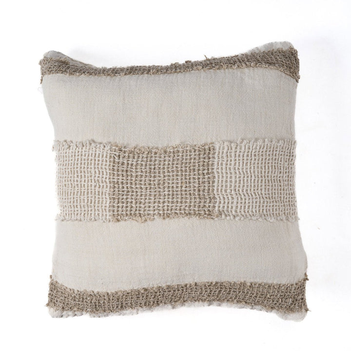 Textured pillow with natural color scheme on a white background