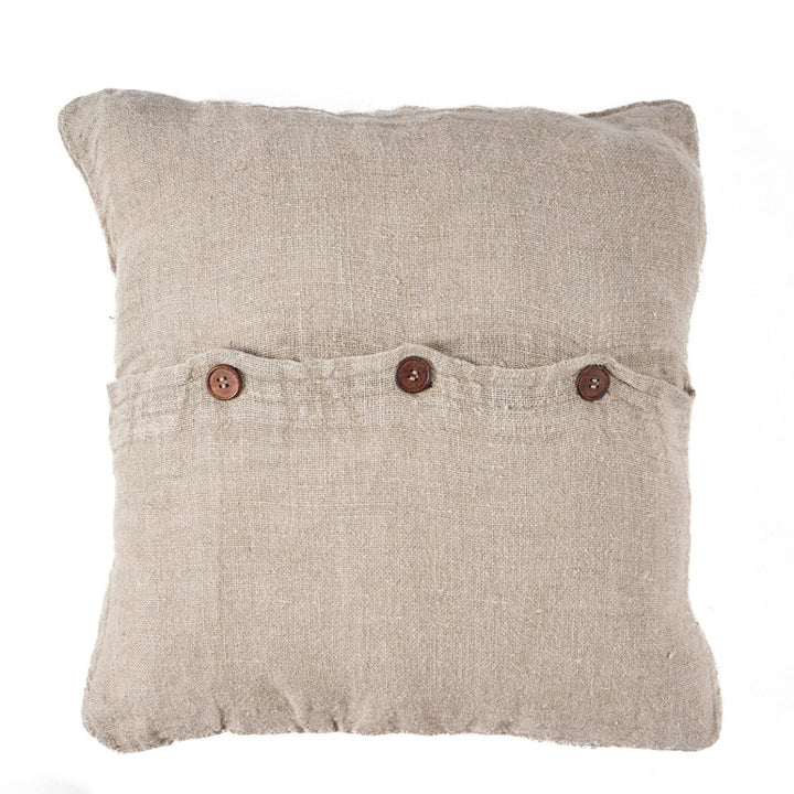 Beige pillow with button details on a white background