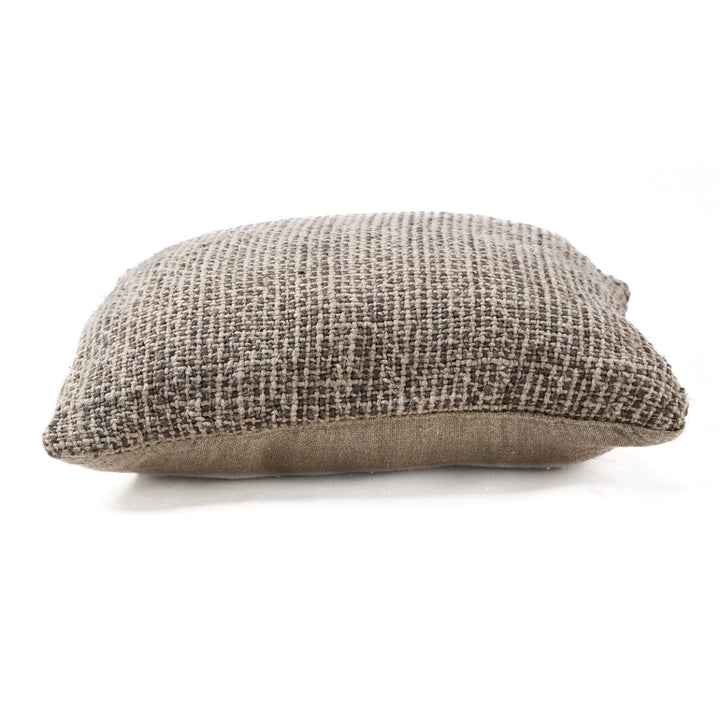 Textured brown pillow on a white background