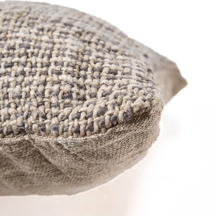 Textured round pillow on a white background