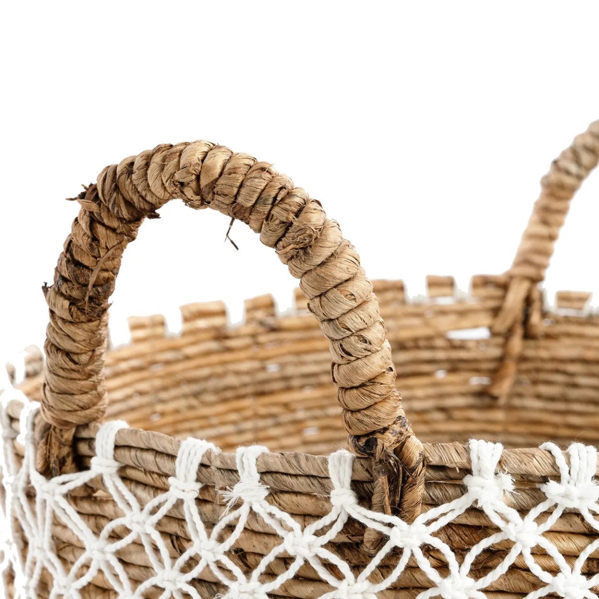 Wicker basket with a decorative handle on a white background