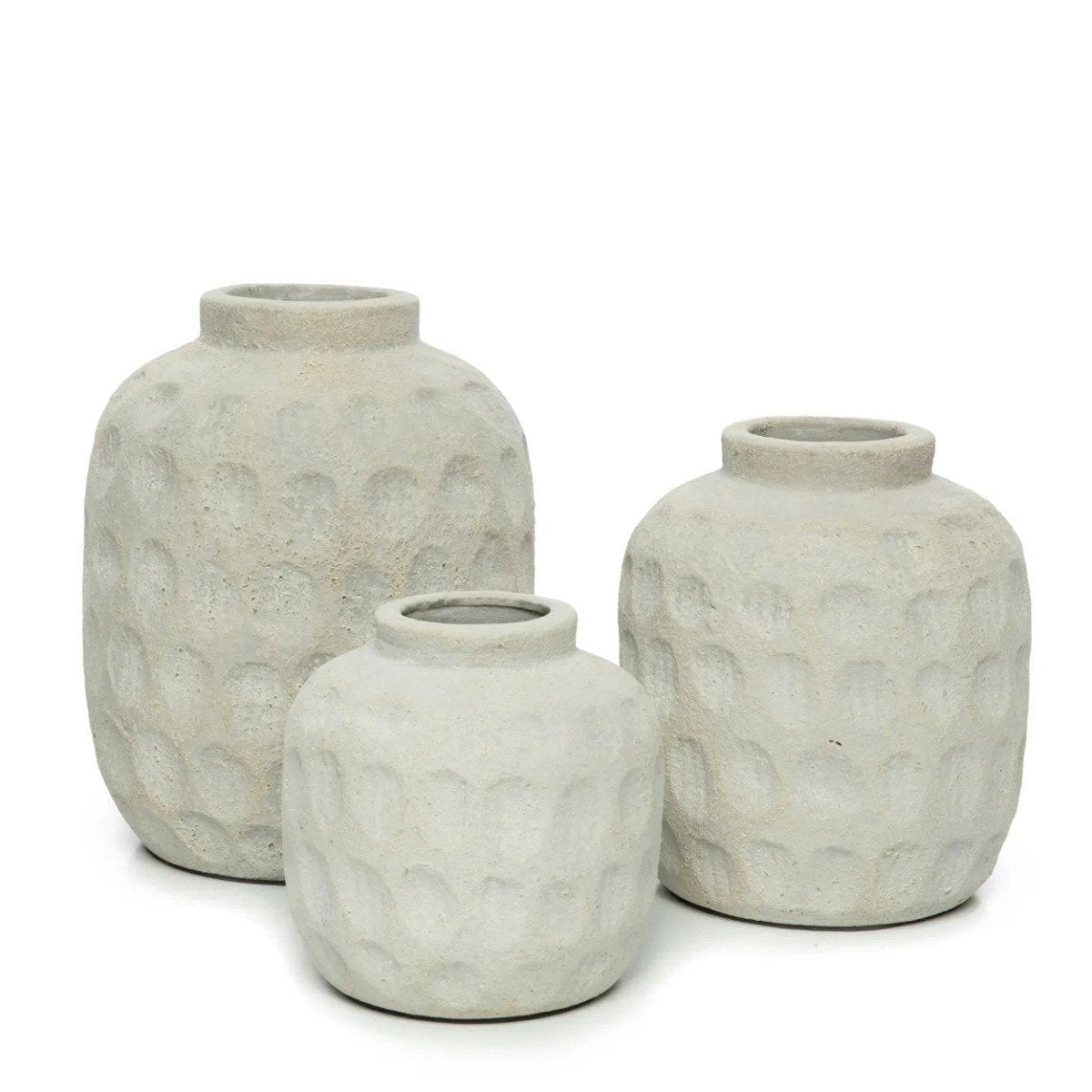 Three gray textured vases of different sizes on a white background
