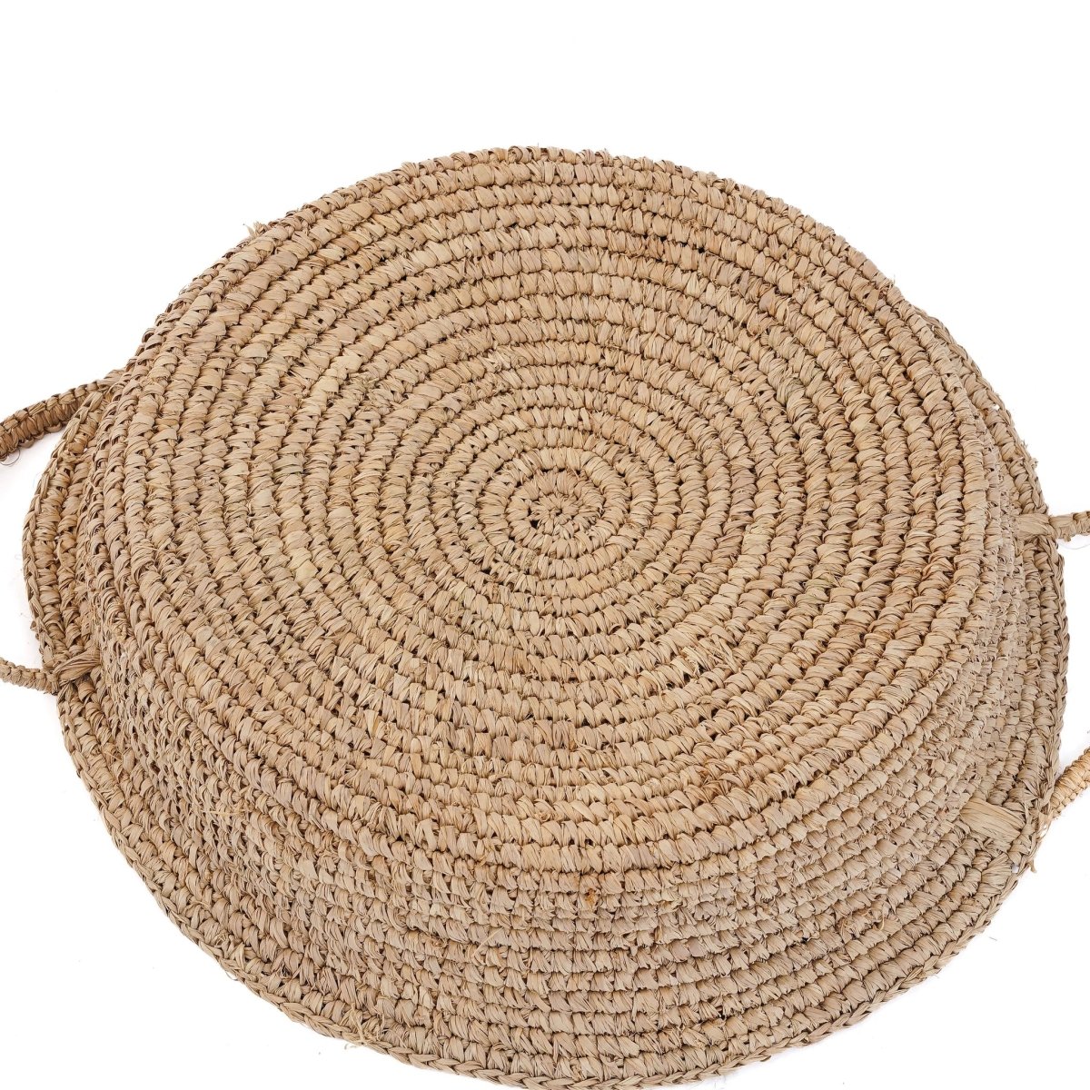 Back of round woven rattan basket on white background 