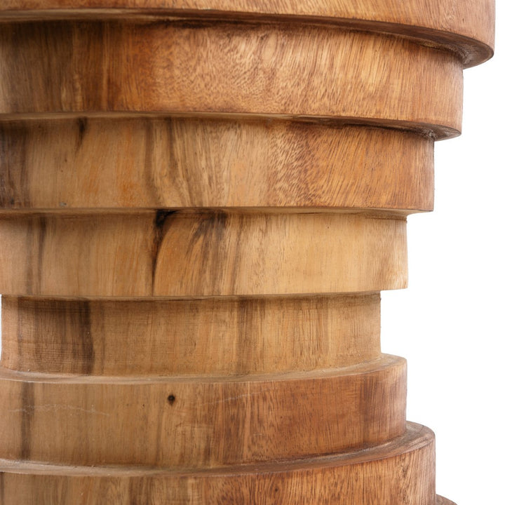 Close-up of a wooden cylindrical object with stacked rings on a white background