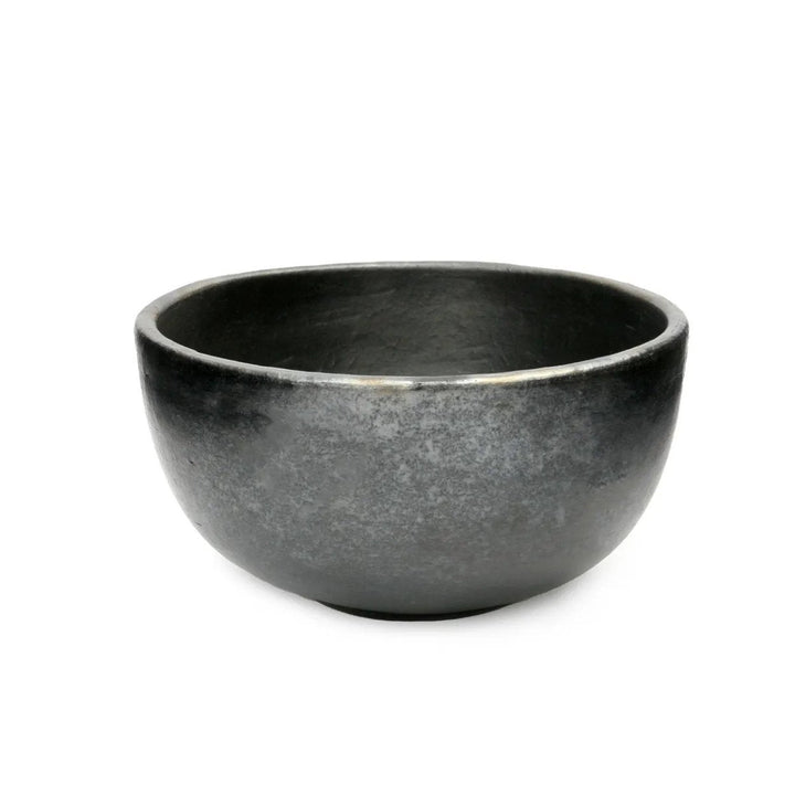 Black ceramic bowl on a white background