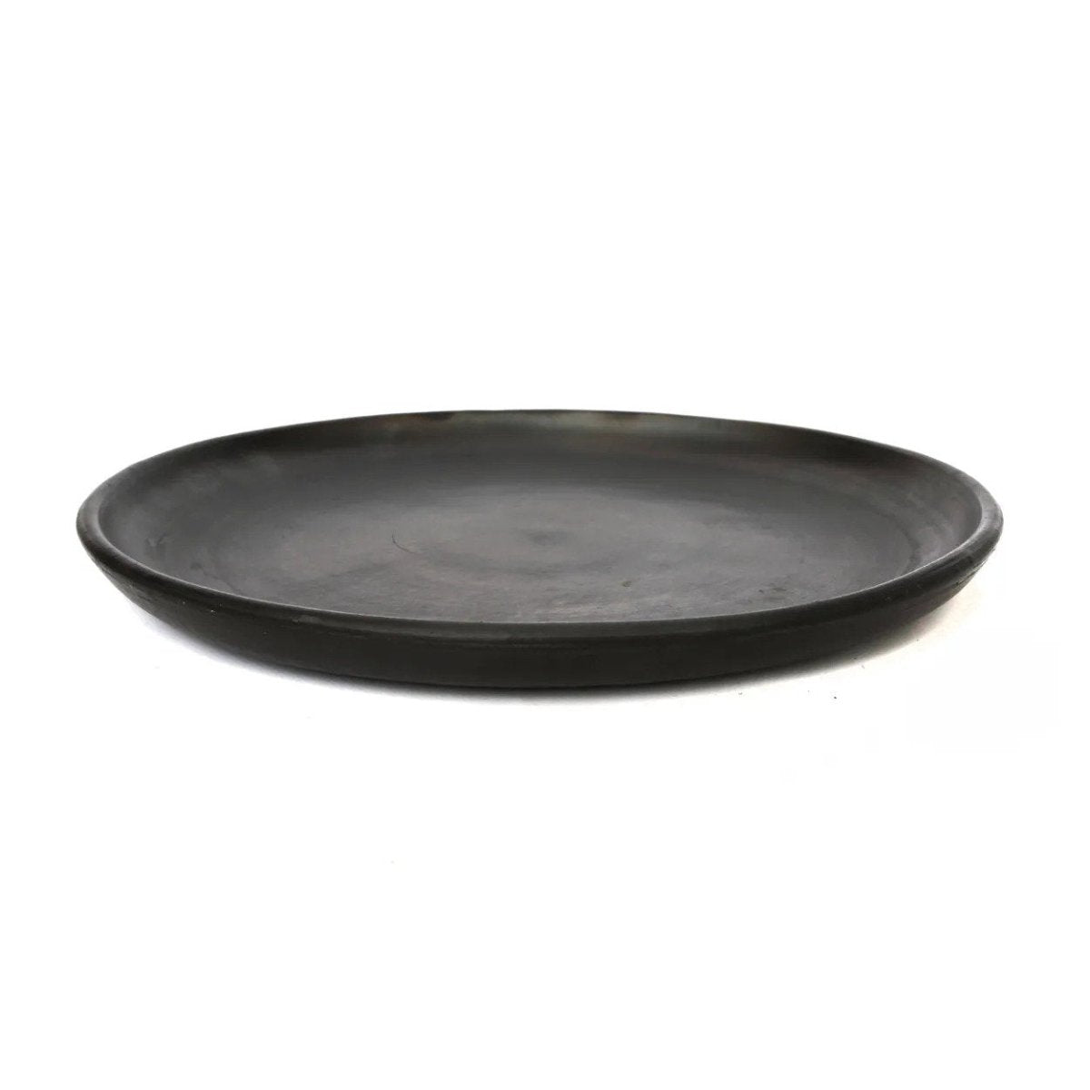 Black ceramic plate on a white background