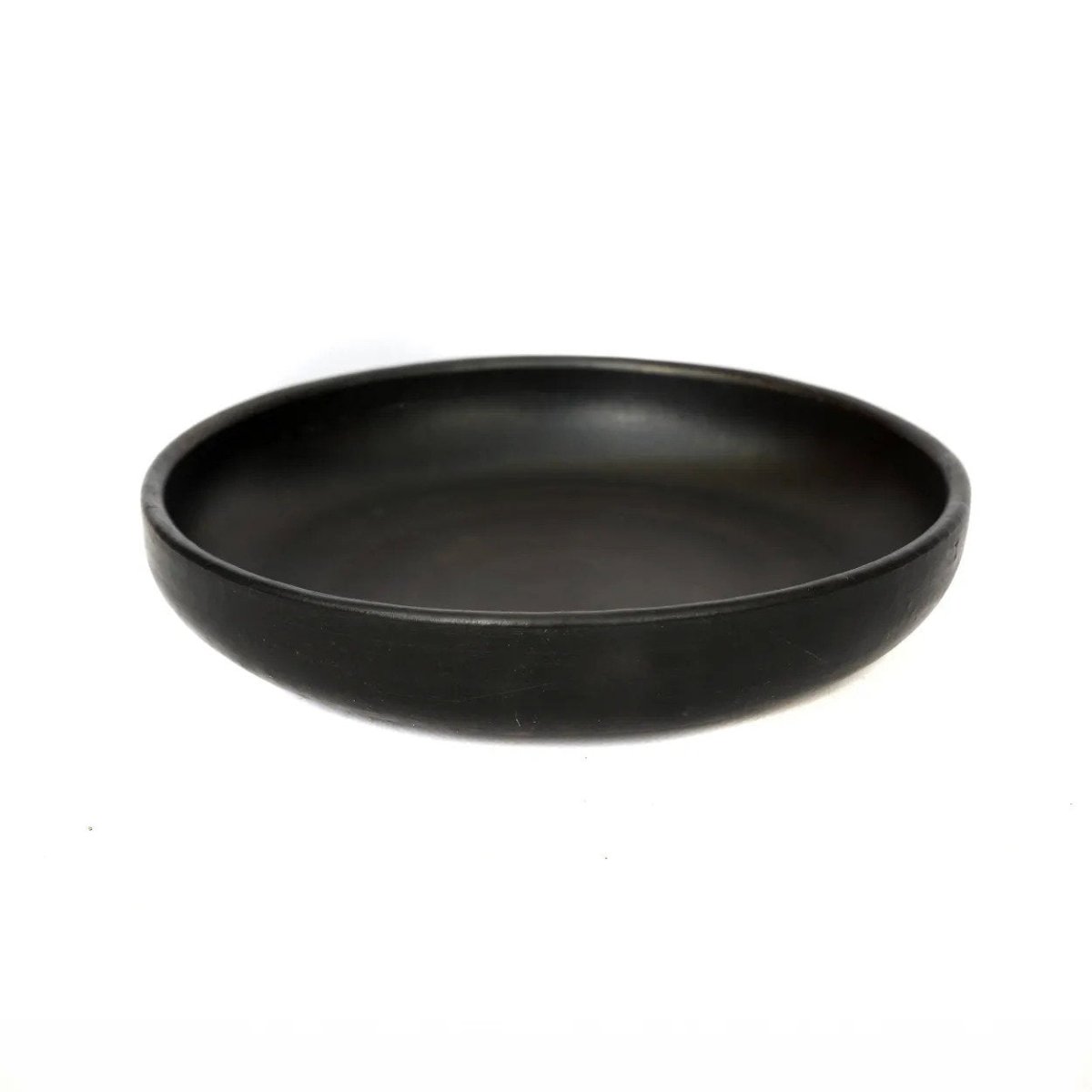 Black ceramic bowl on a white background