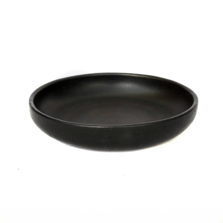 Black ceramic bowl on a white background