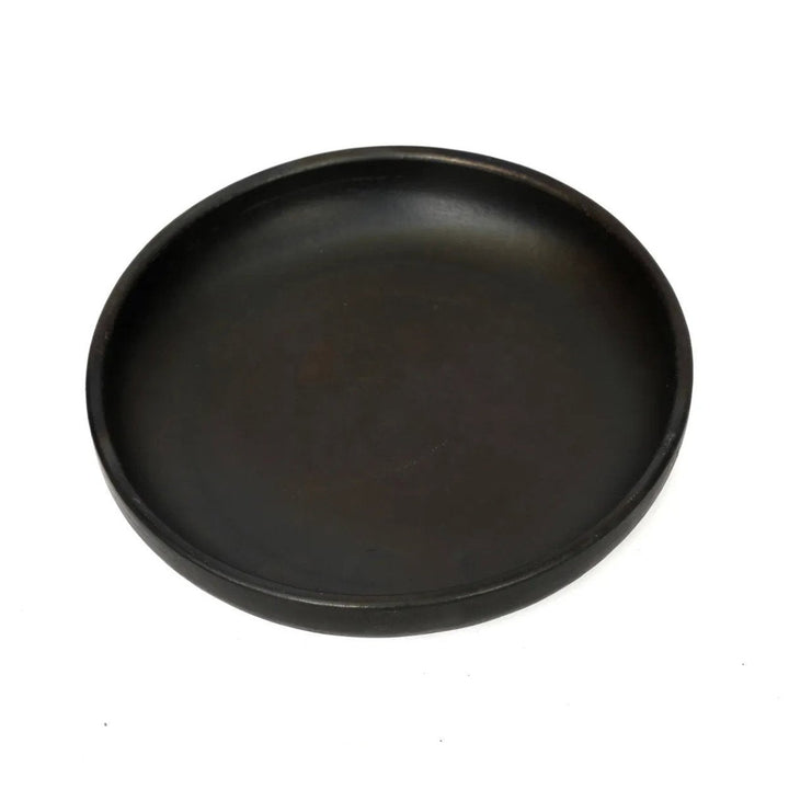 Black round pan on a white background
