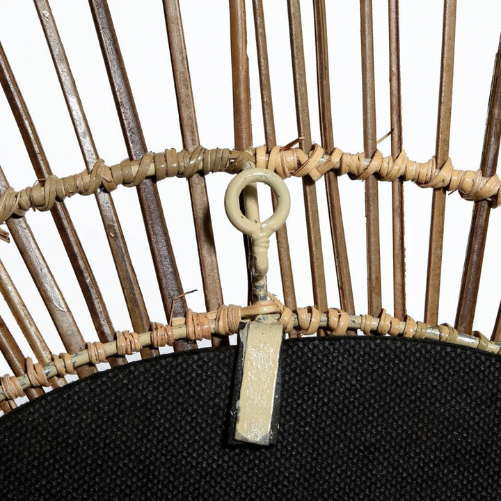 Close-up of a wicker basket with a key attached to it on a white background