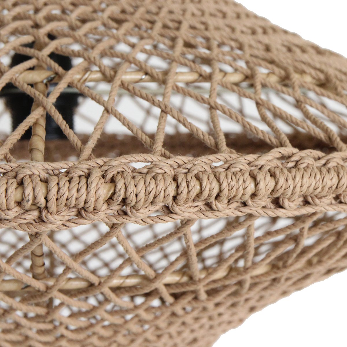 Close-up of a woven rope lamp with a textured pattern on a white background