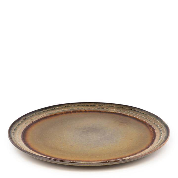 Ceramic plate with a brownish-red glaze on a white background