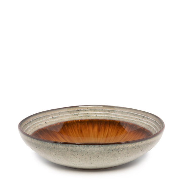 Ceramic bowl with a gradient color from brown to beige on a white background