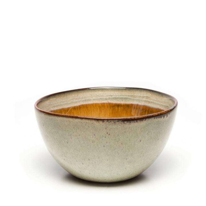 Ceramic bowl with a brown interior on a white background