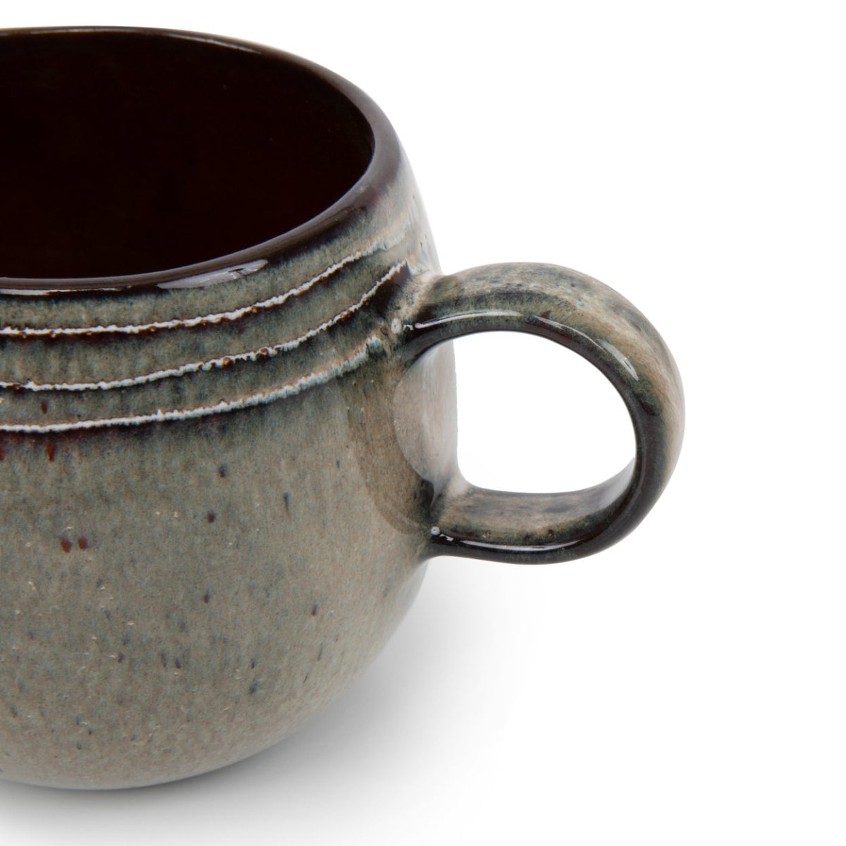 Speckled gray ceramic mug on a white background