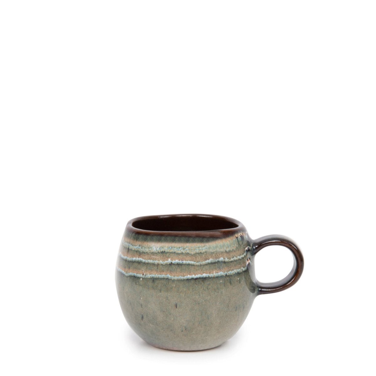 Ceramic mug with a textured surface and brown handle on a white background