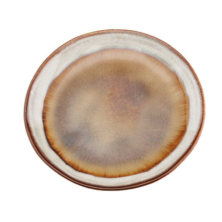 Round ceramic plate with brown and beige gradient on a white background
