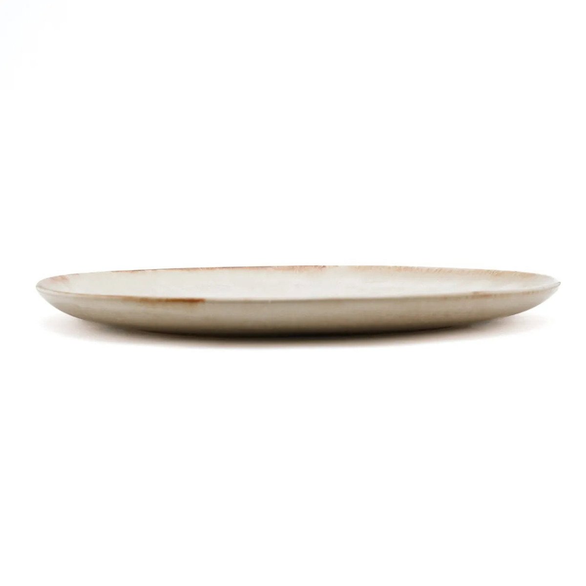 Beige ceramic plate on a white background