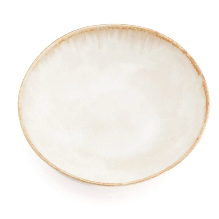 Round ceramic plate with a beige rim on a white background