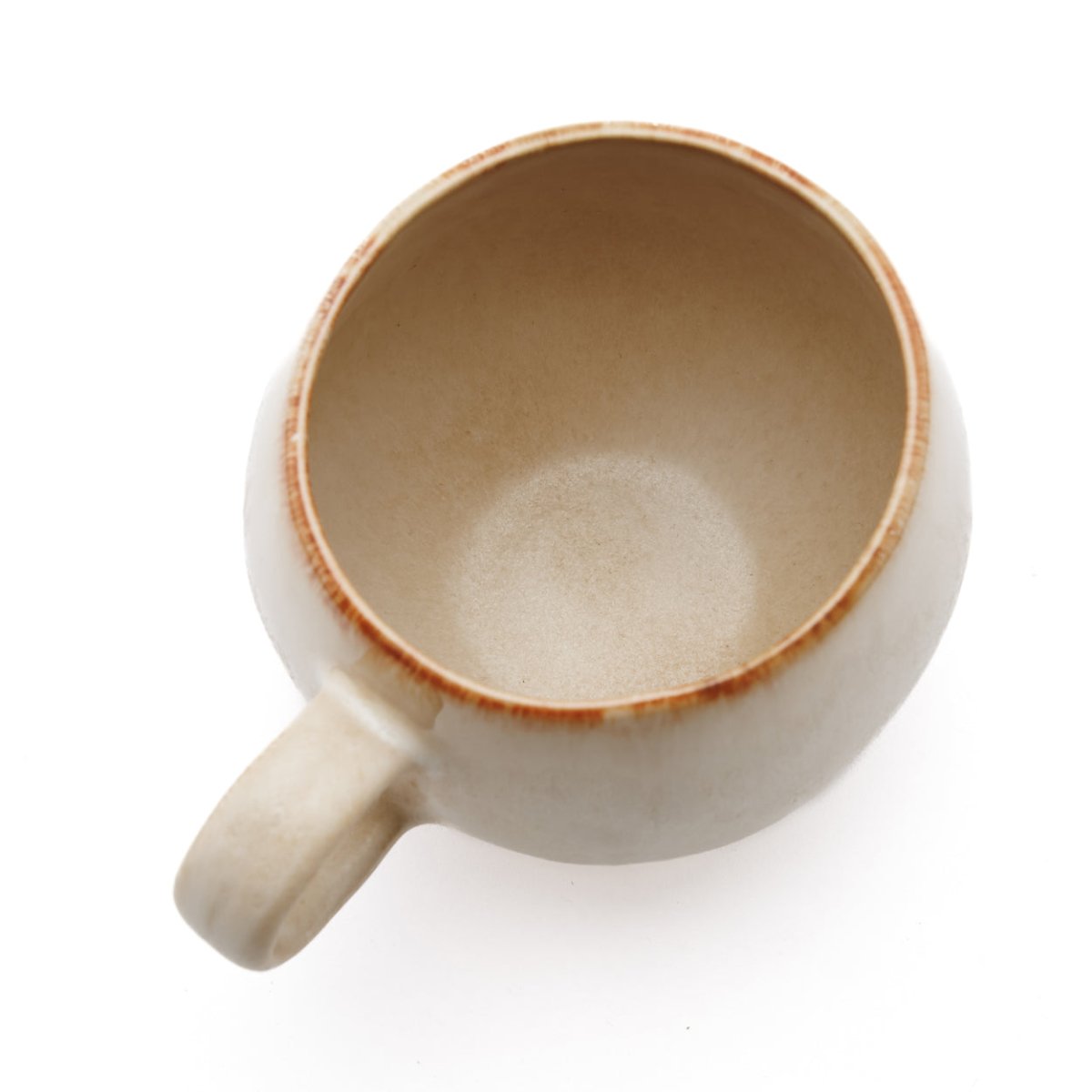 Beige ceramic mug on a white background