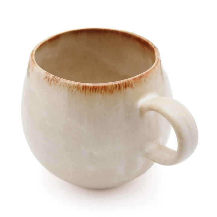 White ceramic mug with brown rim on a white background