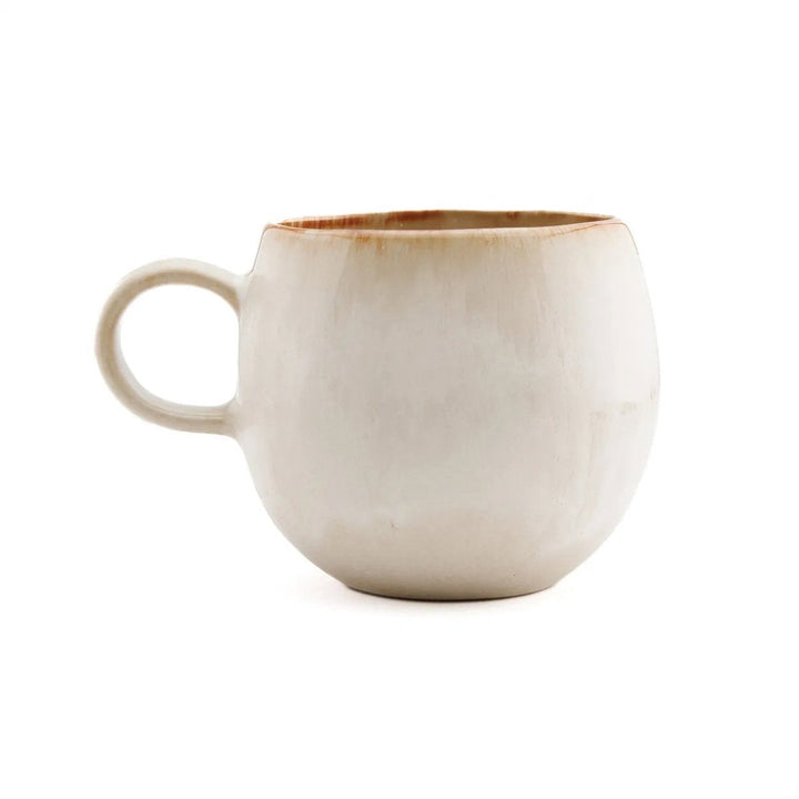 Beige ceramic mug on a white background