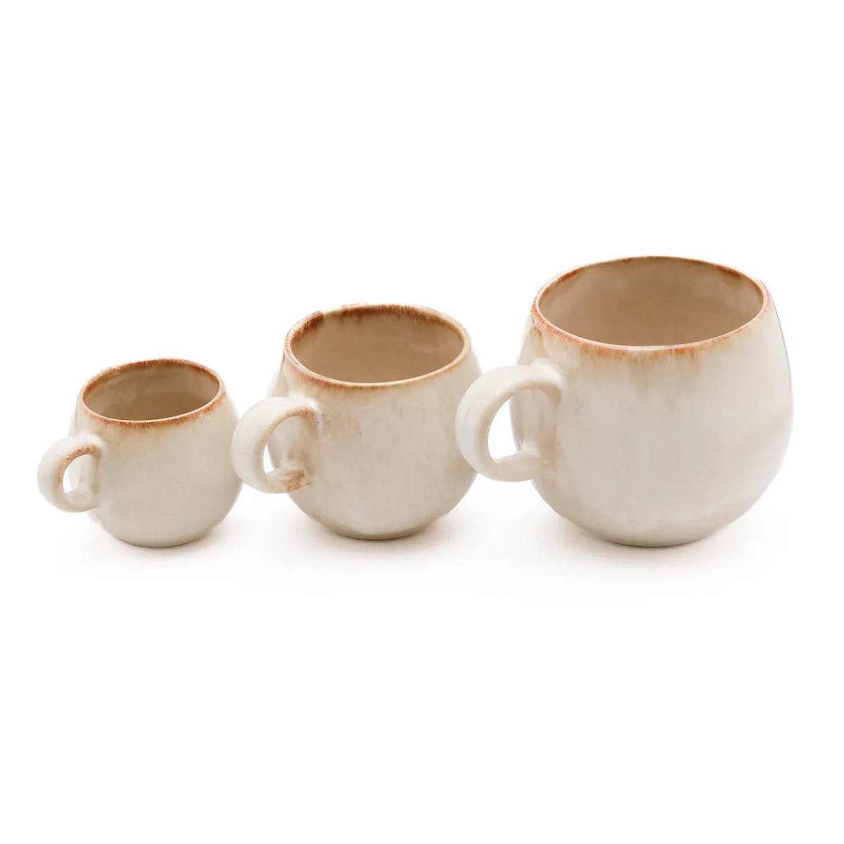 Three ceramic mugs with brown rims on a white background