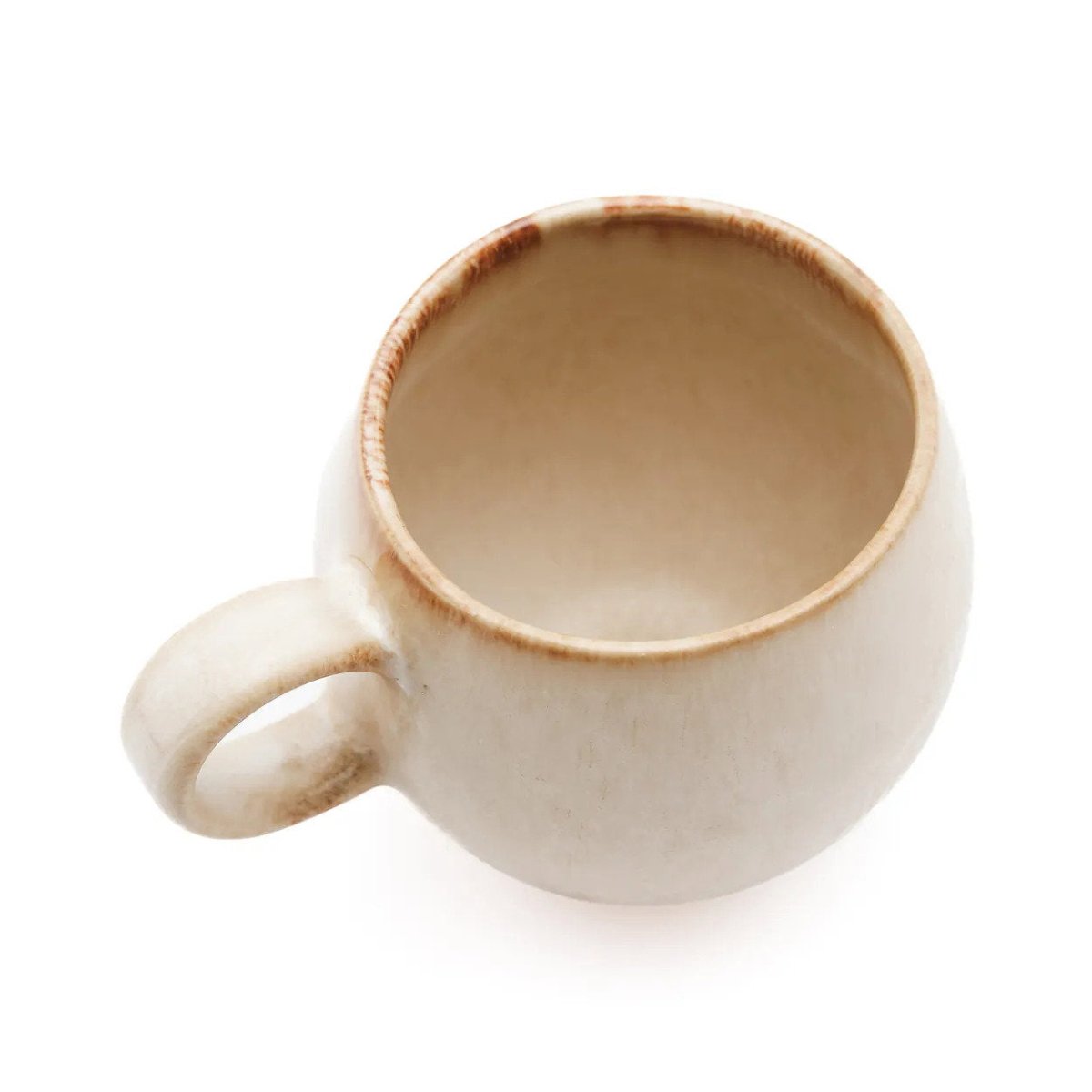 Beige ceramic mug on a white background