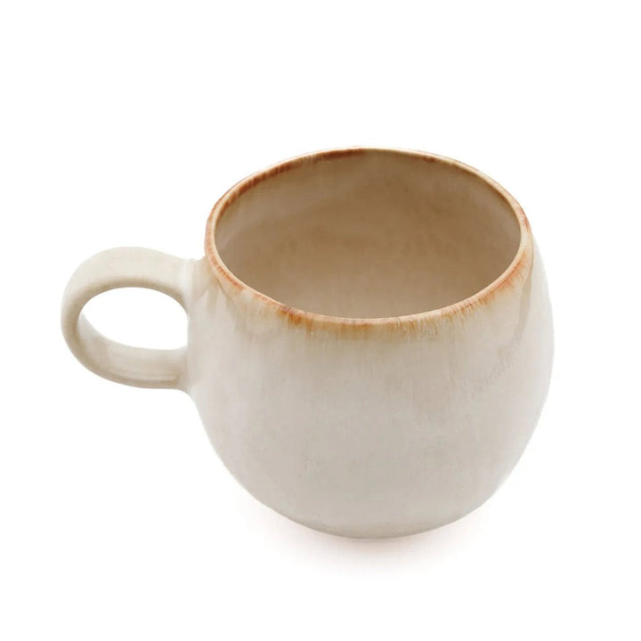 White ceramic mug with brown rim on a white background