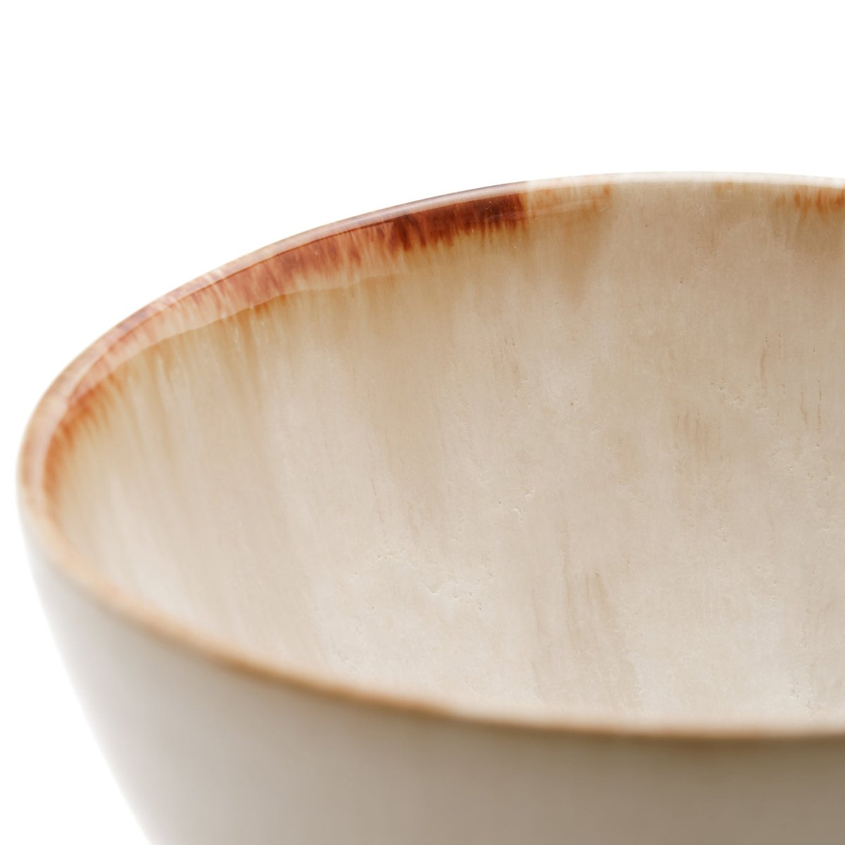 Close-up of a ceramic bowl with a brown rim on a white background
