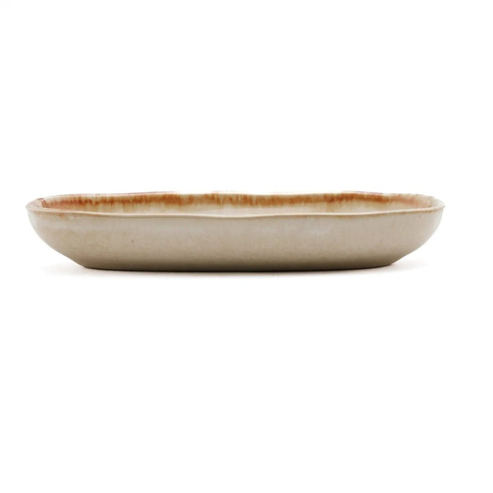 Ceramic bowl with brown rim on a white background