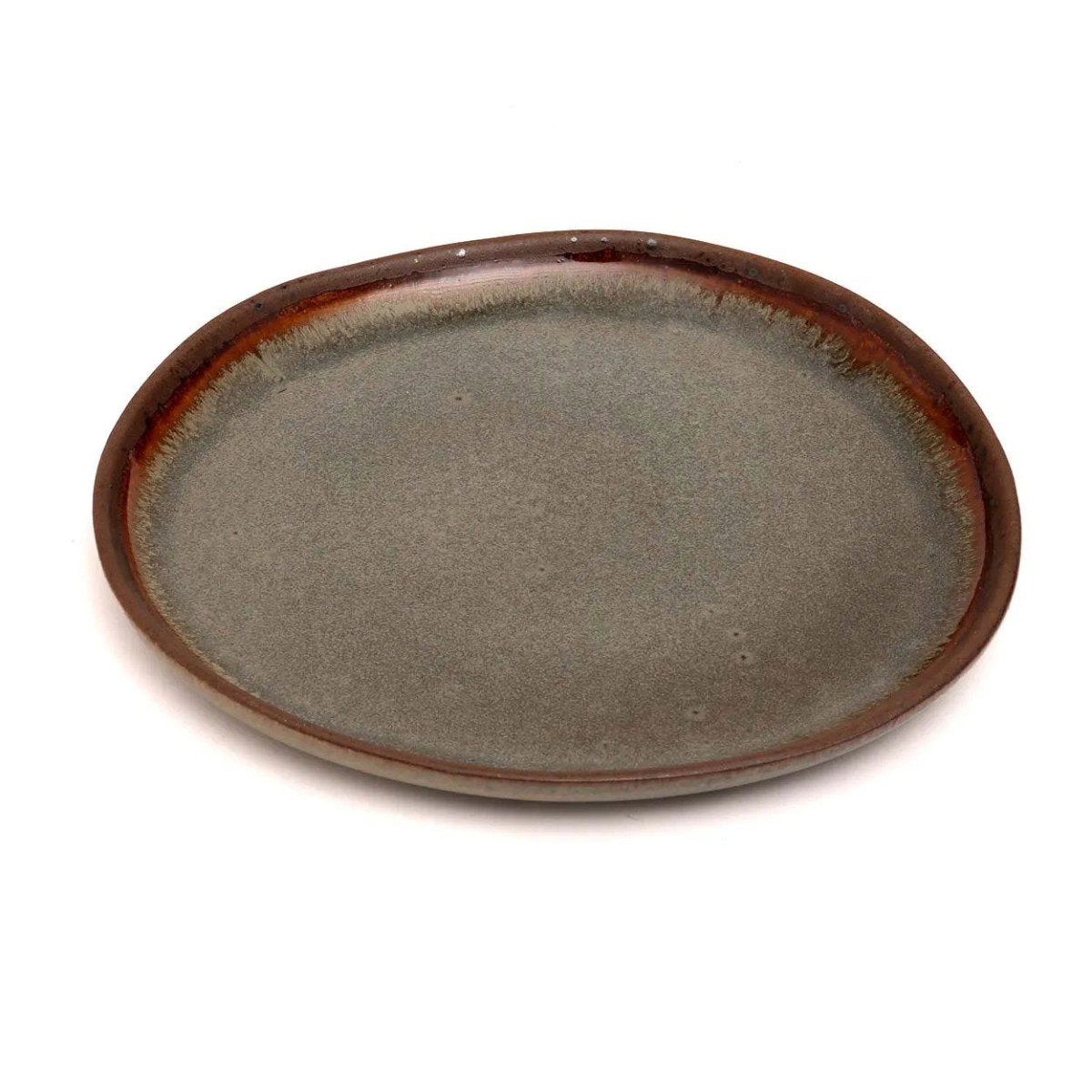 Ceramic plate with brown rim on a white background