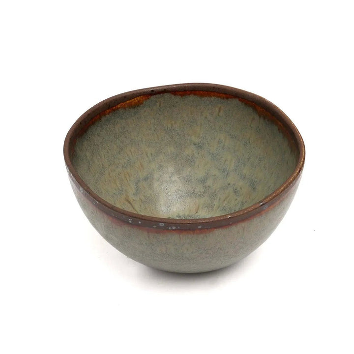 Ceramic bowl with a textured surface on a white background
