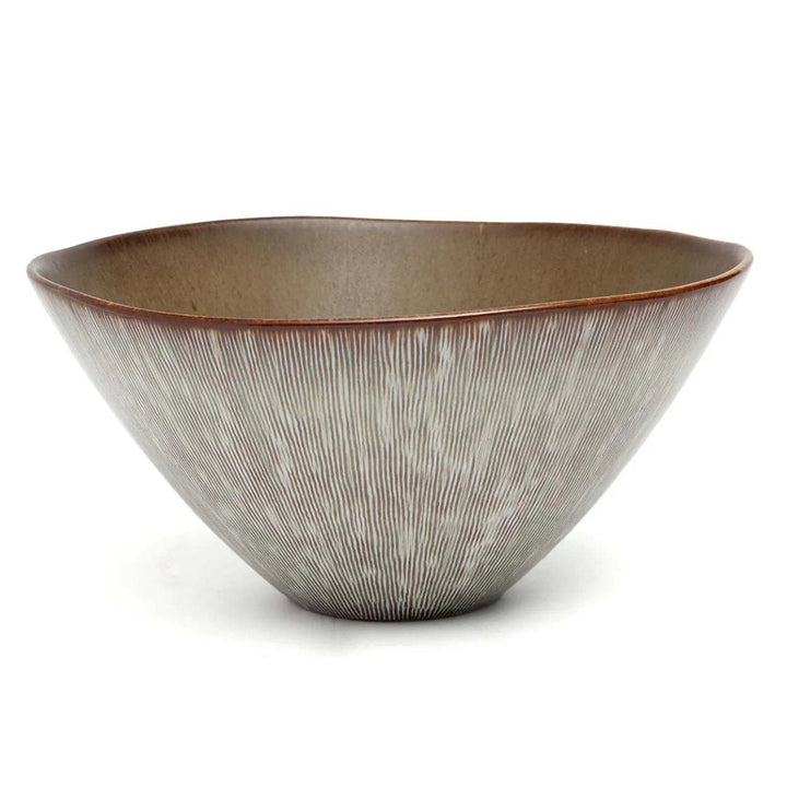 Ceramic bowl with textured surface on a white background